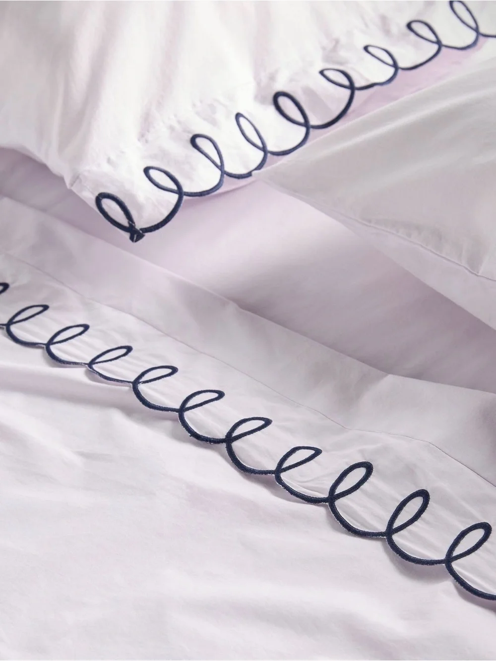 New set of 2 Anthropologie looped standard pillow cases lavender navy embroidery